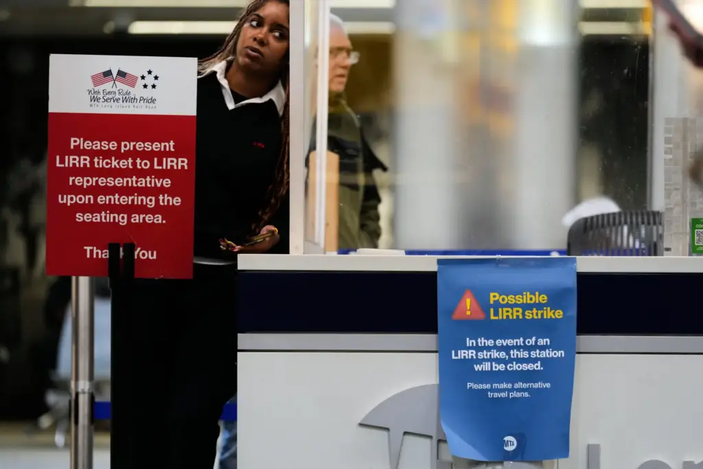 A sign warns commuters of a potential Long Island Rail Road strike at Penn Station.