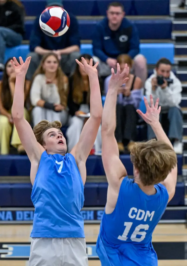 Corona del Mar setter Drake Foley sets the ball during...