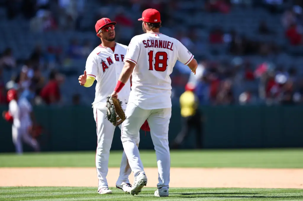 Angels infielders Oswald Peraza, left, and Nolan Schanuel celebrate after...