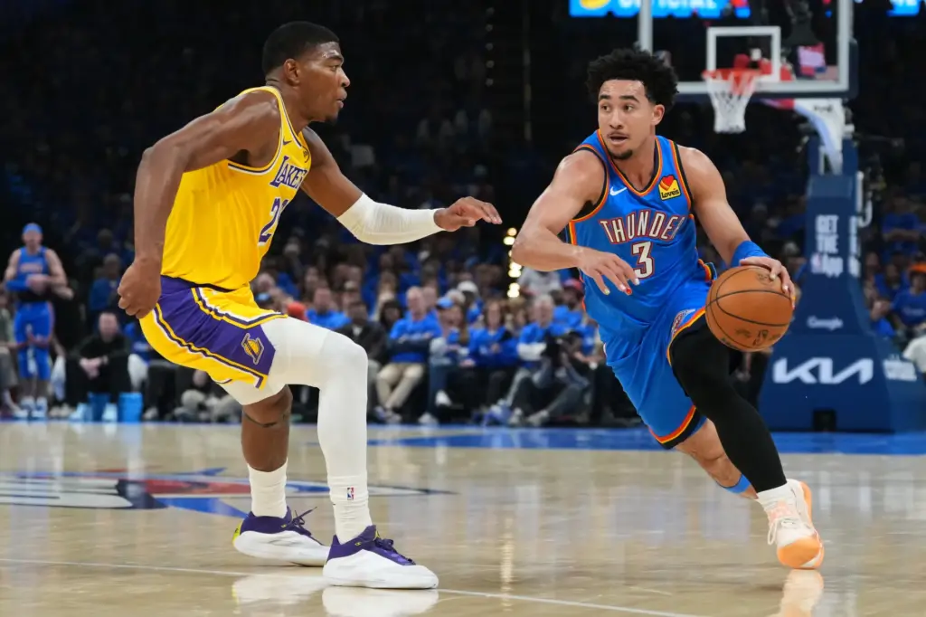 Oklahoma City Thunder guard Jared McCain drives to the basket...