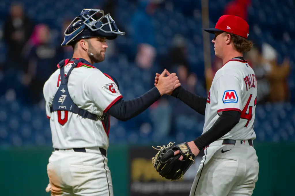 Cleveland Guardians catcher David Fry, left, congratulates relief pitcher Peyton...