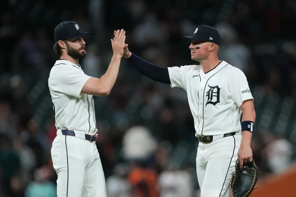 Detroit Tigers relief pitcher Brenan Hanifee, left, and first baseman...