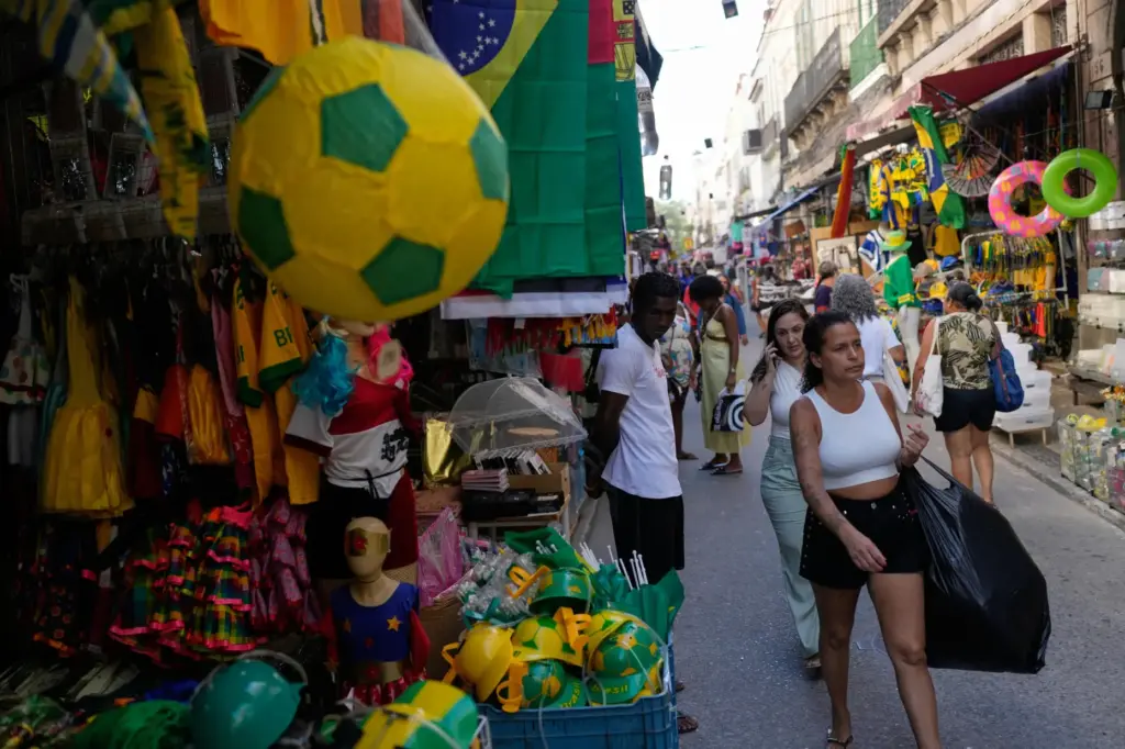 Shoppers walk through the Saara street market in Rio de...