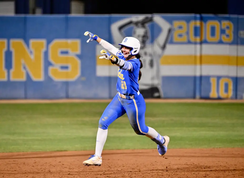 Aleena Garcia #21 of the UCLA Bruins reacts after hitting...
