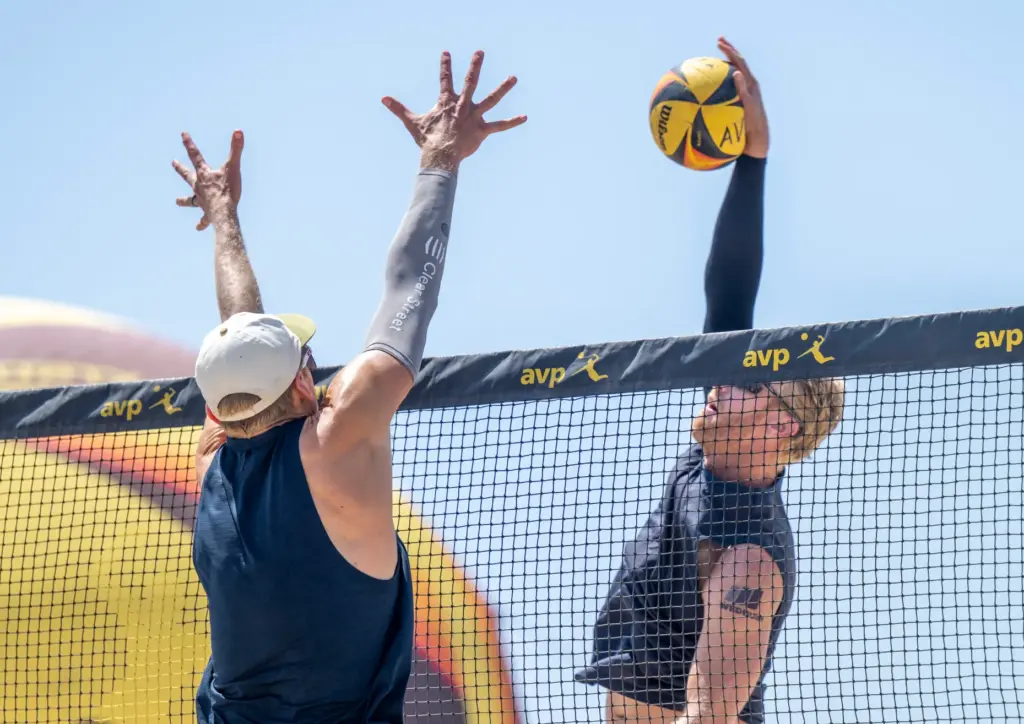 Chase Budinger, right, a former NBA basketball player, hits the...