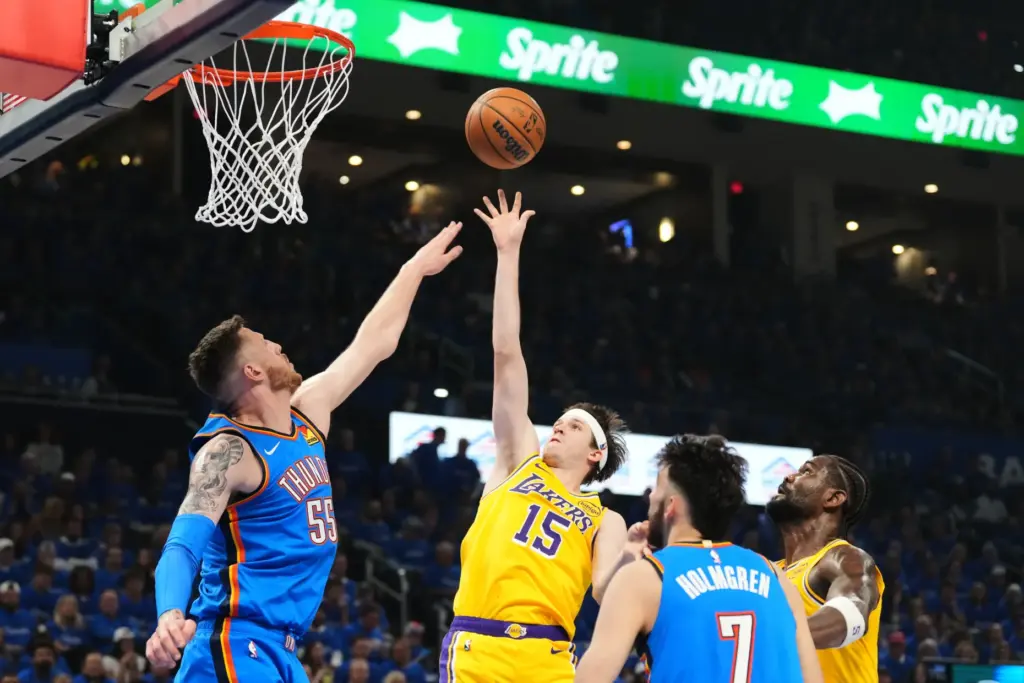 Lakers guard Austin Reaves (15) shoots as Oklahoma City Thunder...