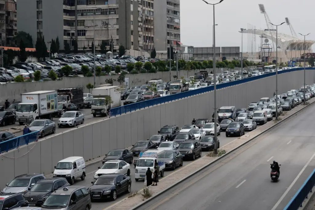 Cars sit in traffic on a highway as residents flee following an Israeli threat.