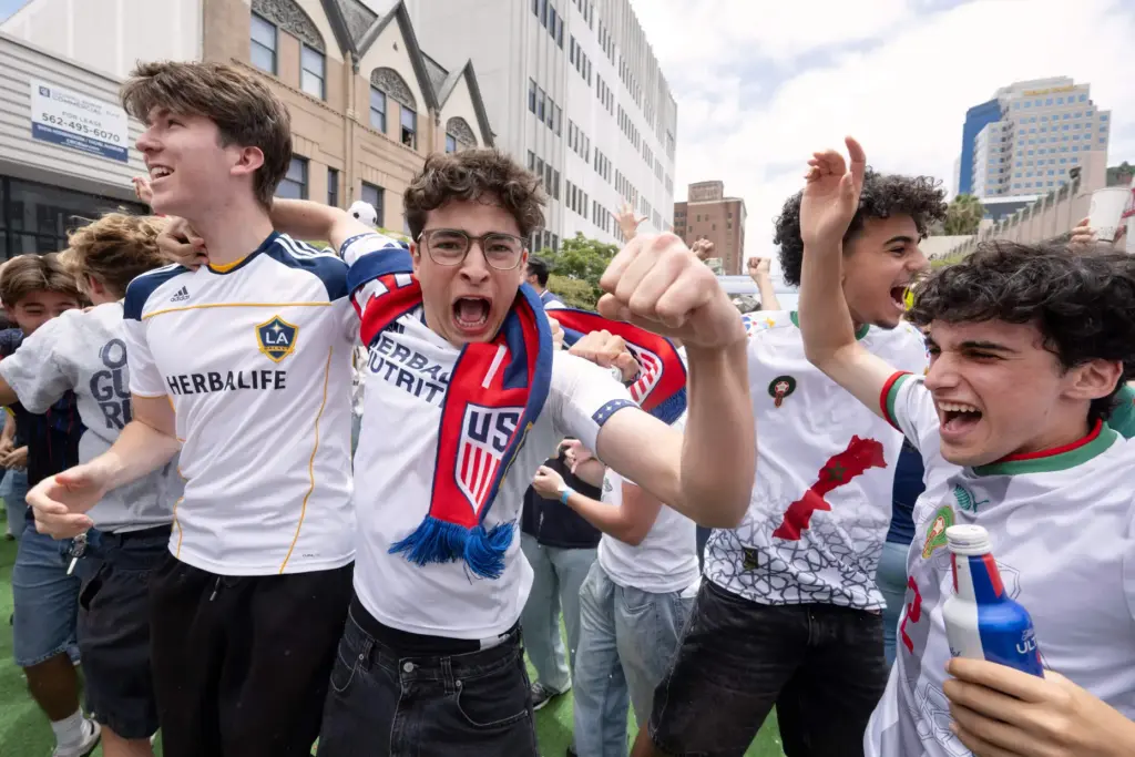 Former Beverly Hills High School soccer players celebrate after U.S.A....
