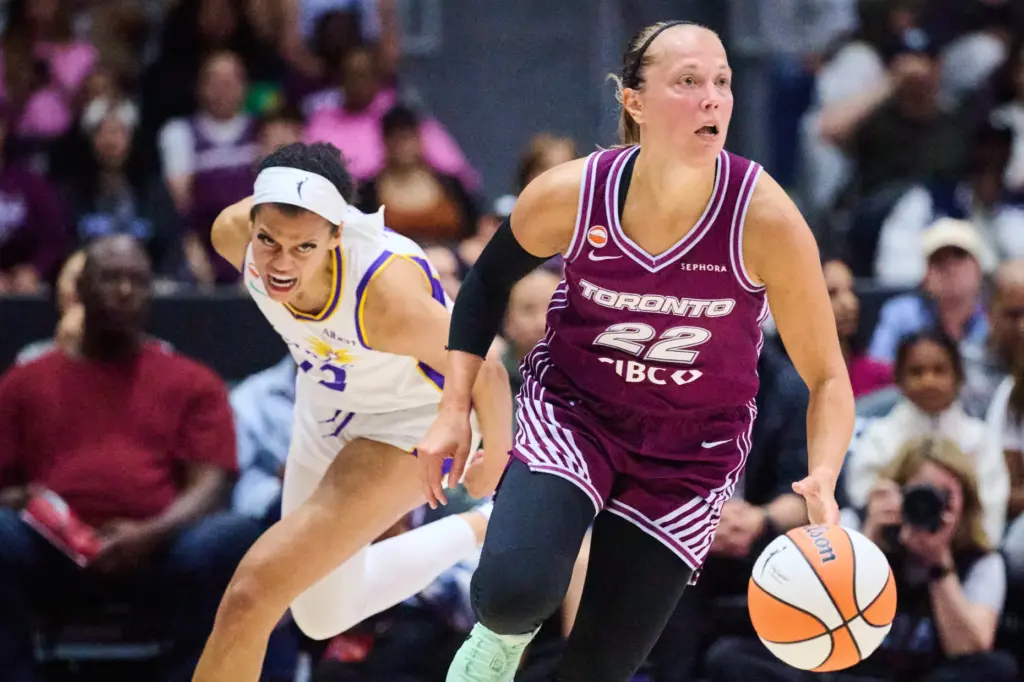 The Toronto Tempo’s Julie Allemand (22) drives past the Sparks’...
