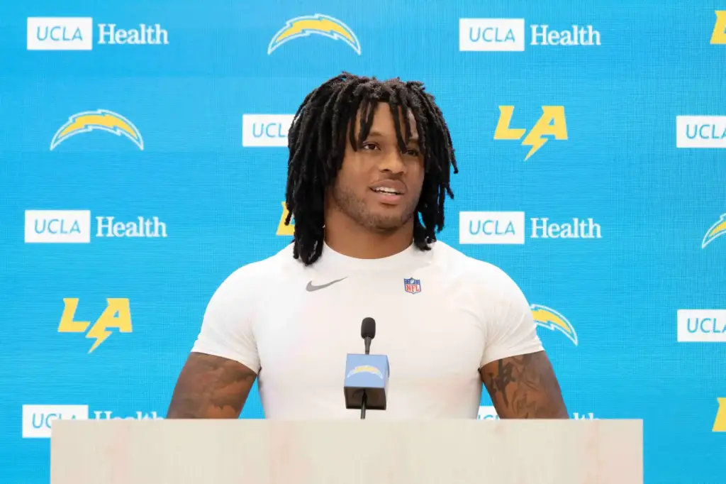 Chargers running back Omarion Hampton takes questions during a press...