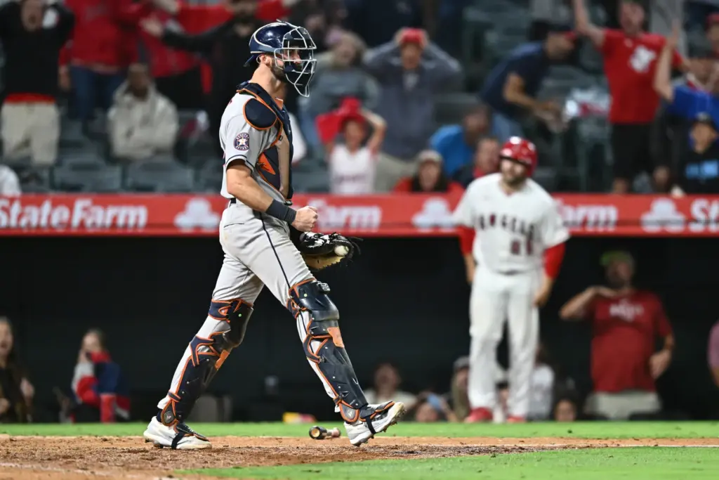 Houston Astros catcher Collin Price reacts after tagging Angels star...
