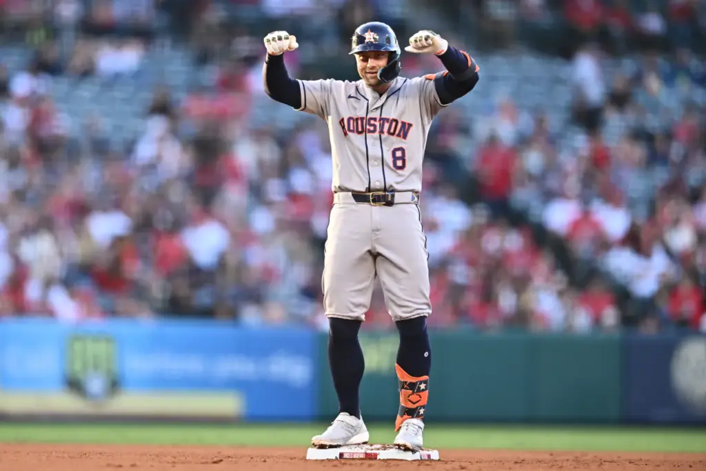The Houston Astros’ Christian Walker gestures after hitting an RBI...