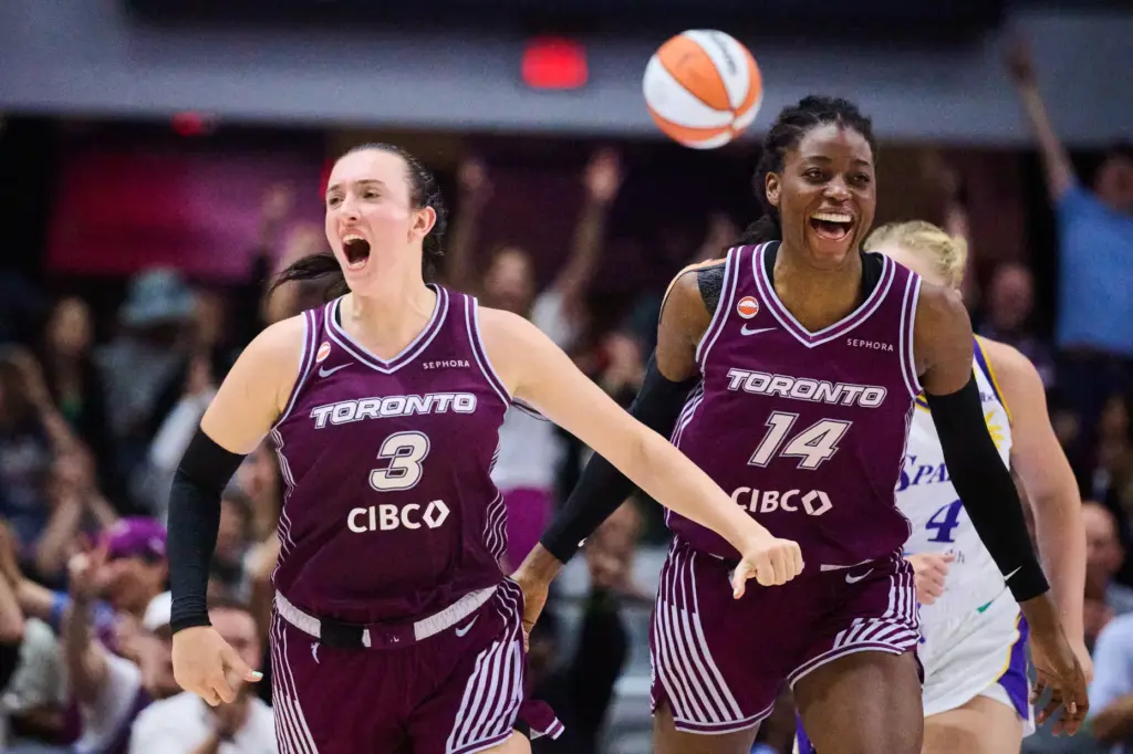 The Toronto Tempo’s Marina Mabrey, left, celebrates alongside Temi Fagbenle...