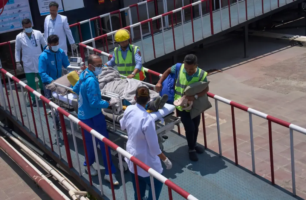Medics take Dawa Sherpa, a mountain guide who had been...