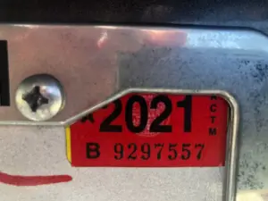 Can you report a vehicle’s expired registration tag to the authorities?