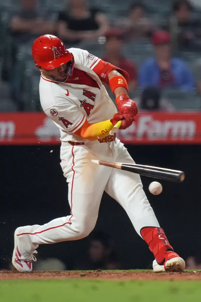 The Angels’ Oswald Peraza breaks his bat while hitting an...