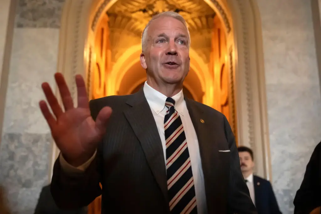 FILE – Sen. Dan Sullivan, R-Alaska, speaks to reporters at...