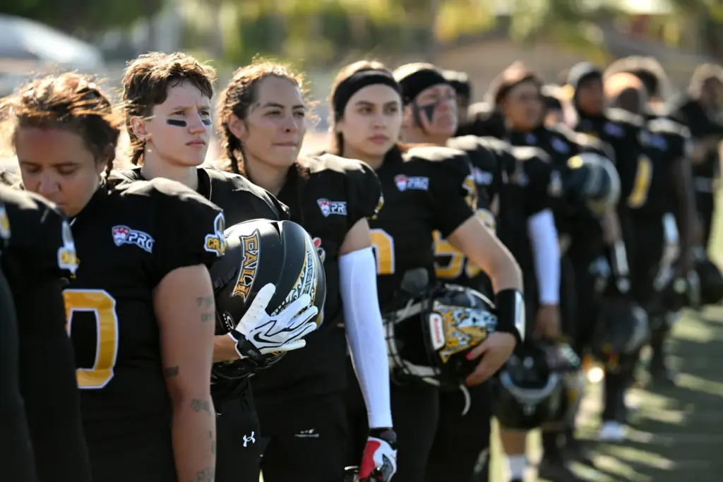 Cali War team members line up for the national anthem...