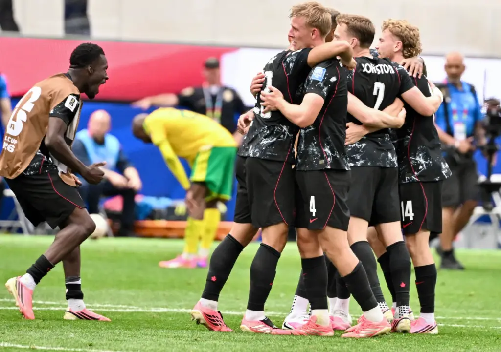 Canada celebrates after defeating South Africa 1-0 to win a...
