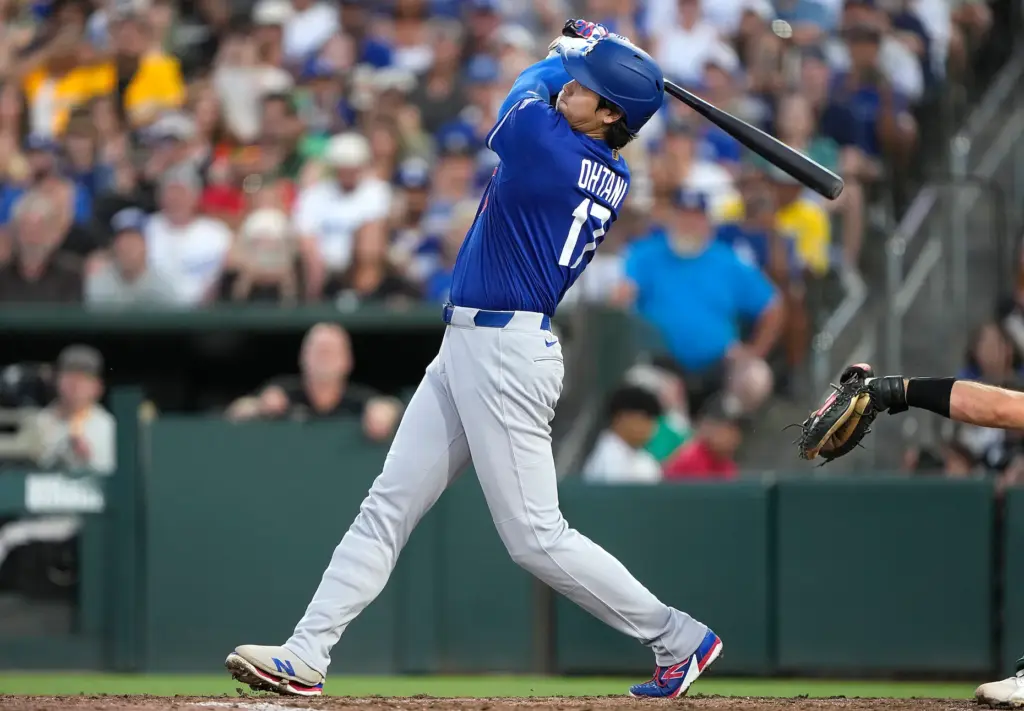 Dodgers star Shohei Ohtani hits a three-run home run during...