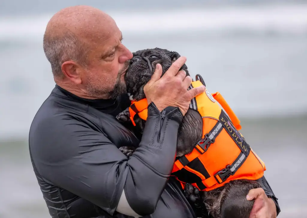 David Fasoli of Pleasanton kisses his French bulldog, Iza, after...