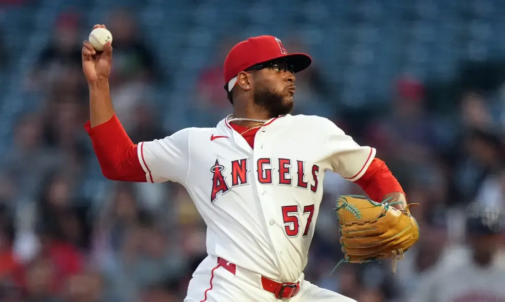 Angels starting pitcher Walbert Urena throws to the plate during...
