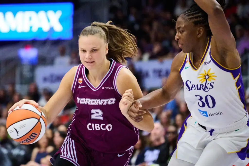 The Toronto Tempo’s Laura Juskaite (2) drives past the Sparks’...