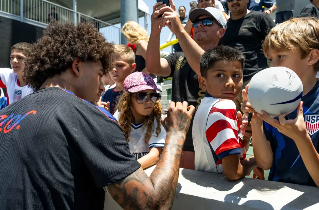 U.S. Menâs National Team member Chris Richards signs autographs after...