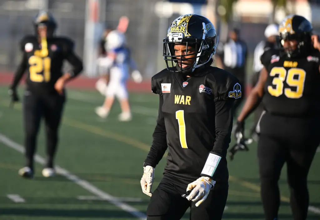 Cali War wide receiver Ninotchka Cloud walks off the field...