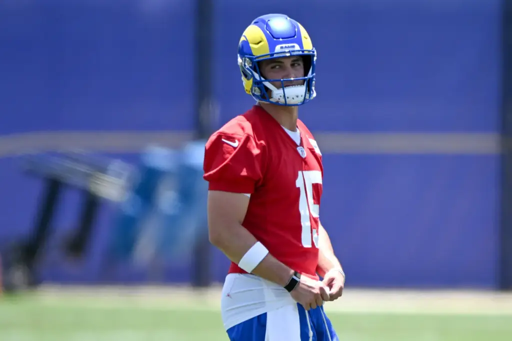 Rams rookie quarterback Ty Simpson looks on during an OTA...