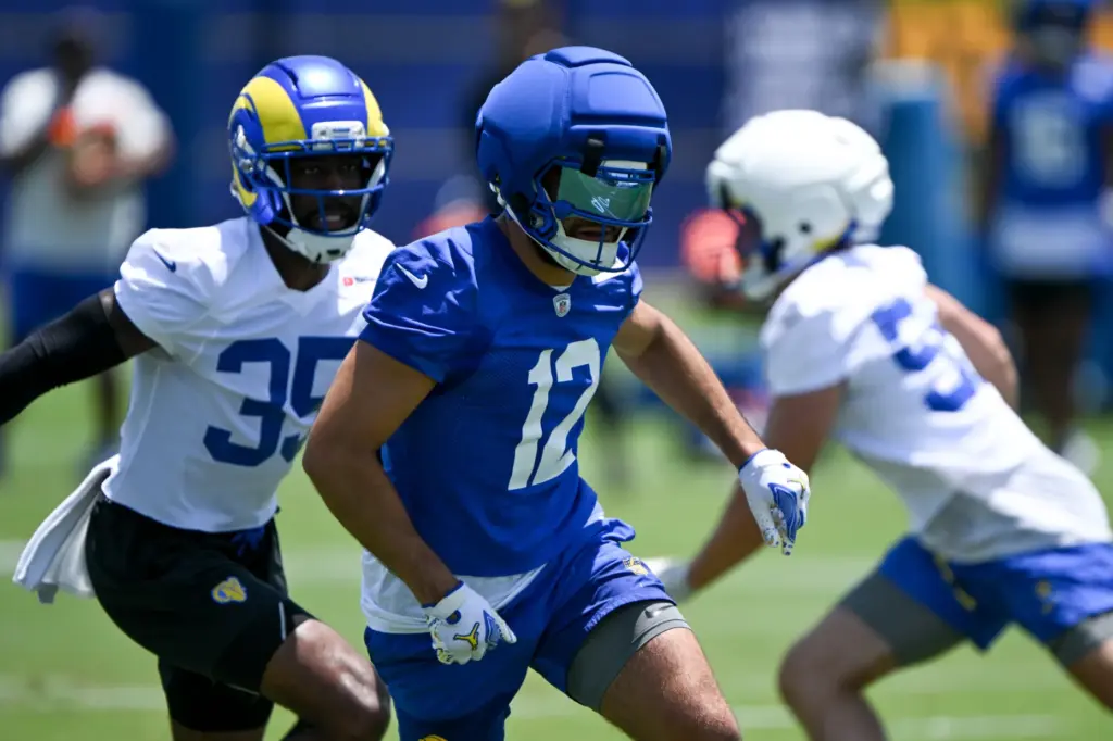 Rams wide receiver Puka Nacua (12) goes through drills during...