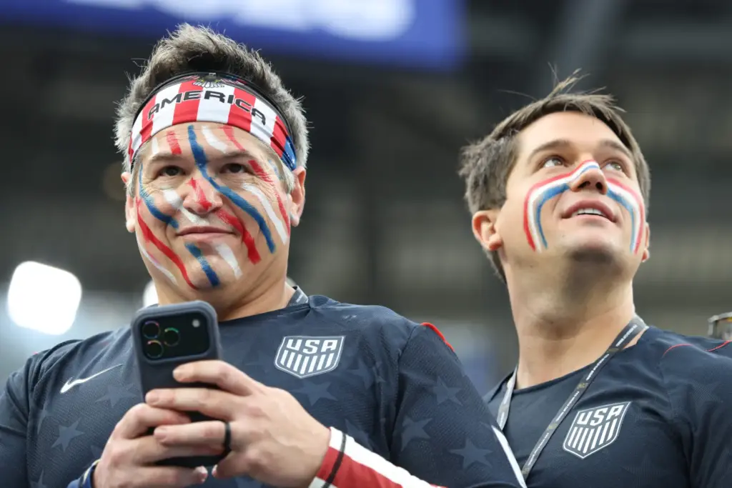 United States fans look on before the star of a...