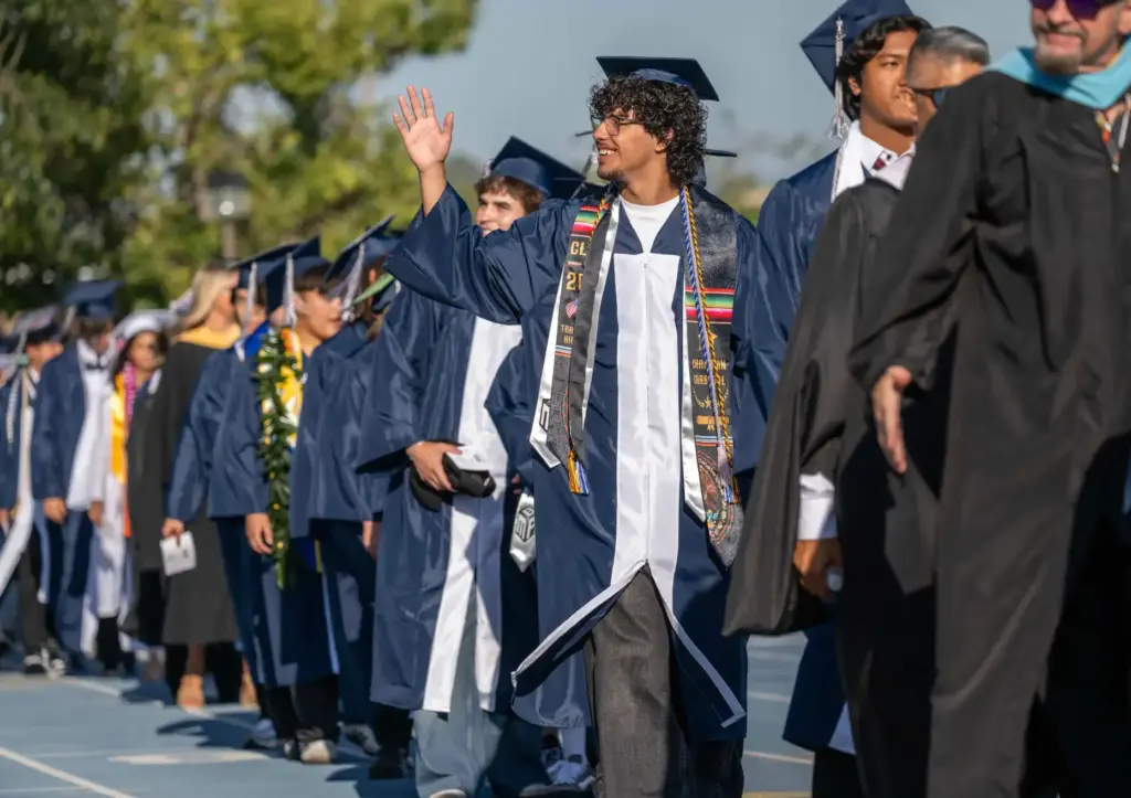 Members of Trabuco Hills High Schoolâs class of 2026 wave...