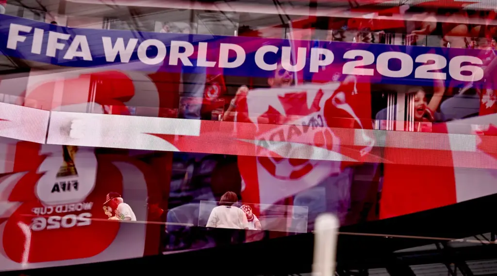 Canada fans reflected in glass prior toa FIFA World Cup...