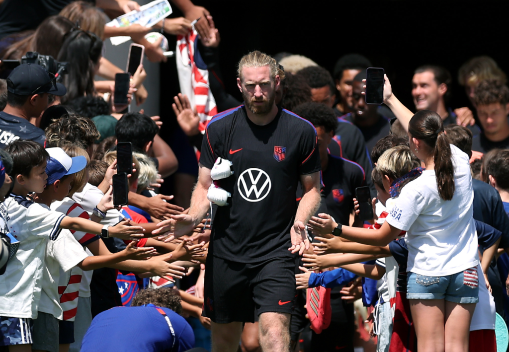 Captain Tim Ream leads the United States team onto the...