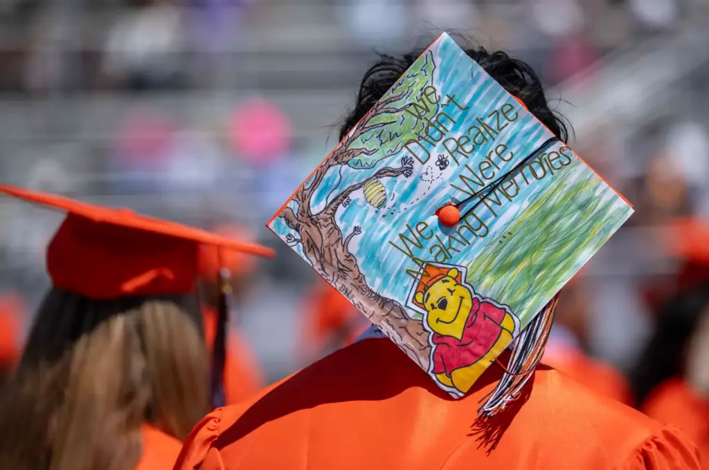 One Orange High School graduate sports a Winnie the Pooh-themed...
