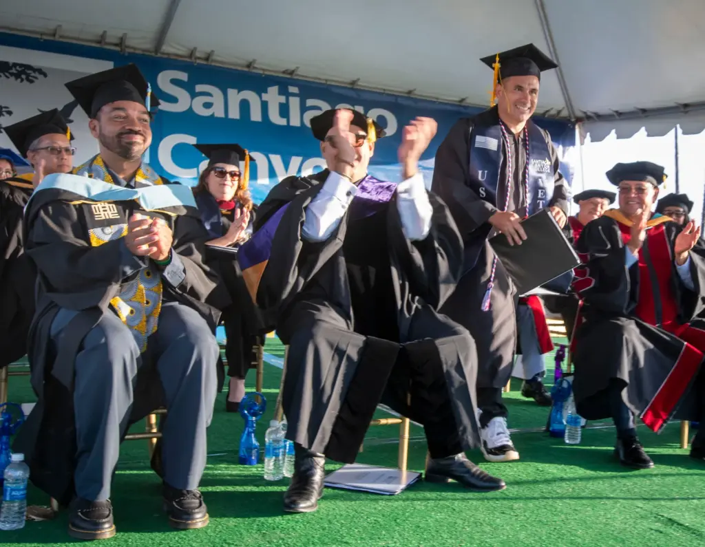 Valedictorian Jeno Jorgensen heads to the podium at Santiago Canyon...