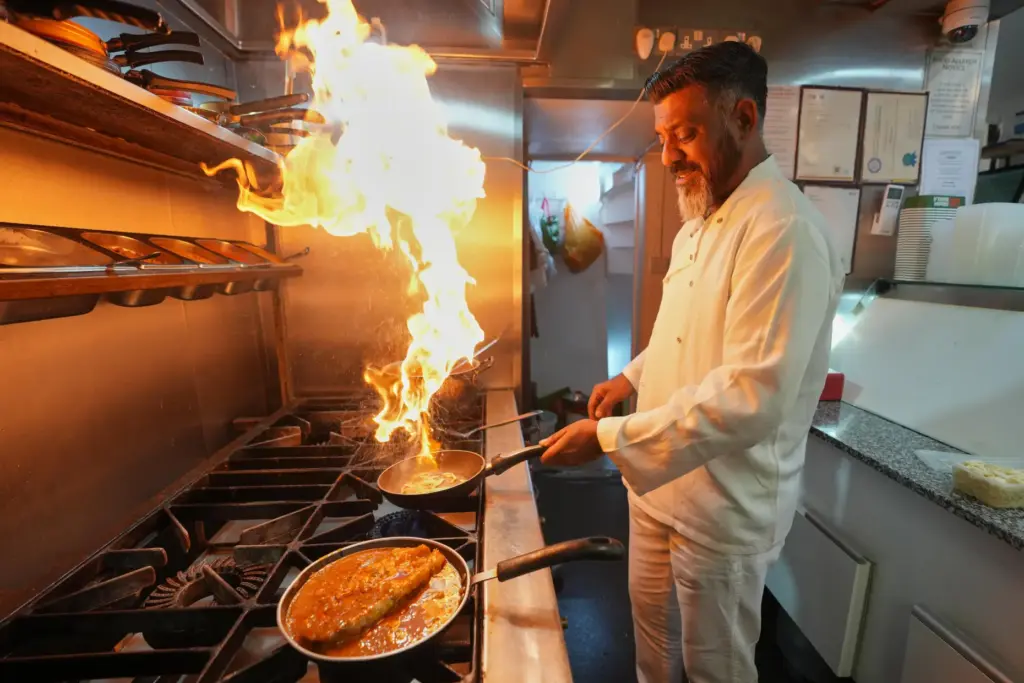 Chef Mohammed Shanoor Ali cooks at a Bangladeshi restaurant in...
