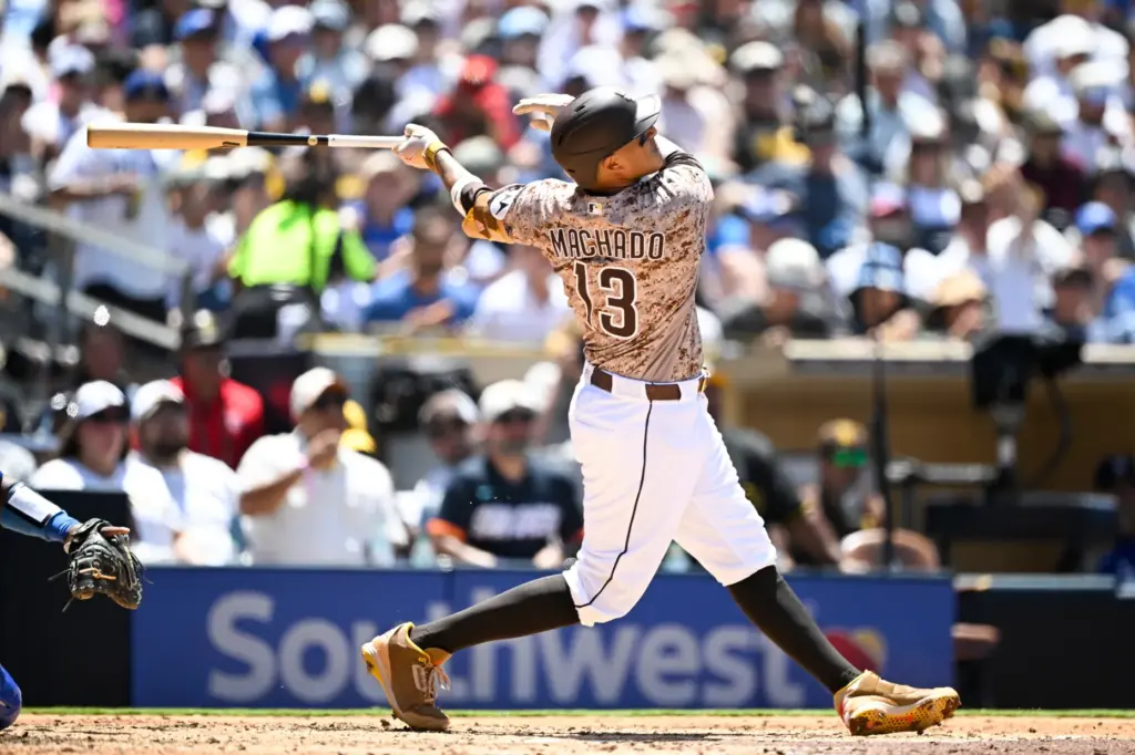 San Diego Padres’ Manny Machado hits a solo home run...