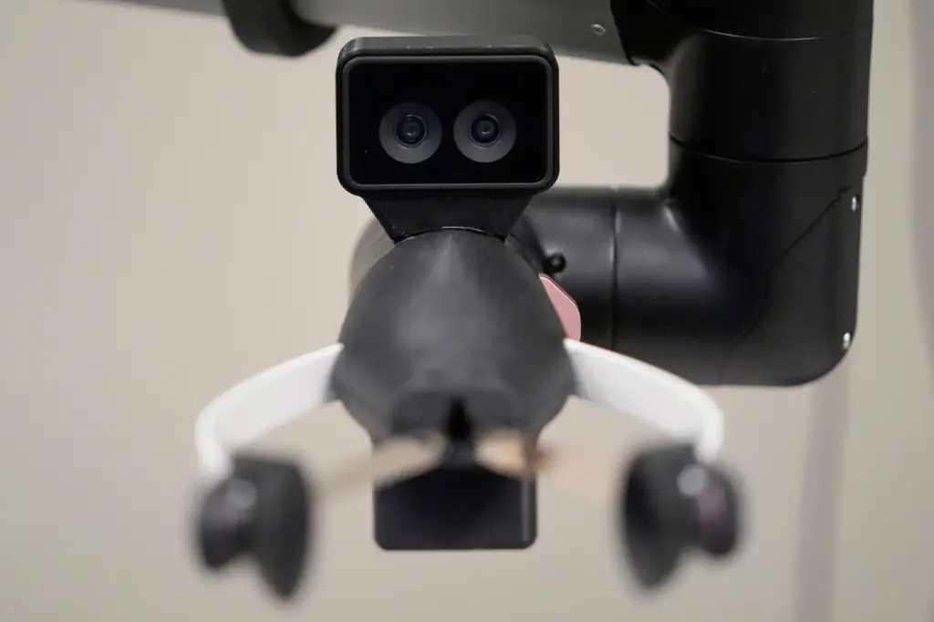 A camera on the hand of a Hello Robot uses two lenses for improved depth perception.