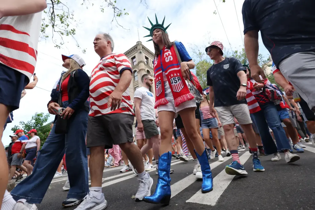 United States fans march to the match before the World...
