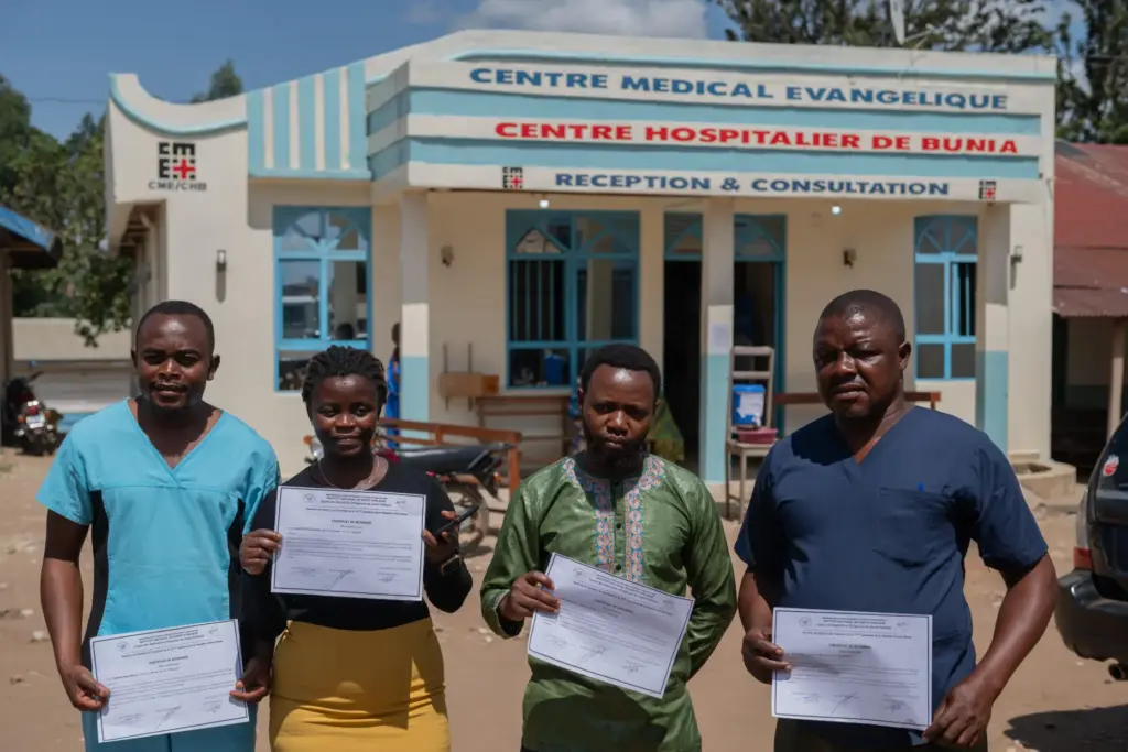 Healthcare workers who have recovered from Ebola pose for a photo in Bunia, Congo.