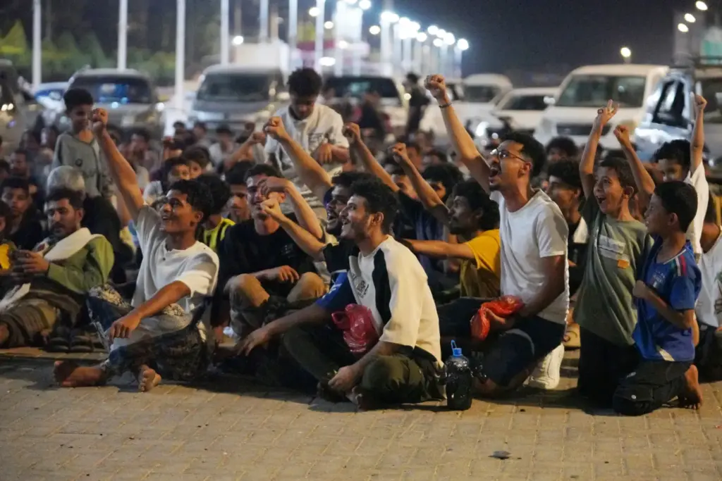Fans gather to watch the first match of the World...