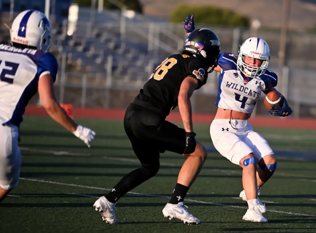 Cali War defensive back Alyssa Williams goes for the tackle...