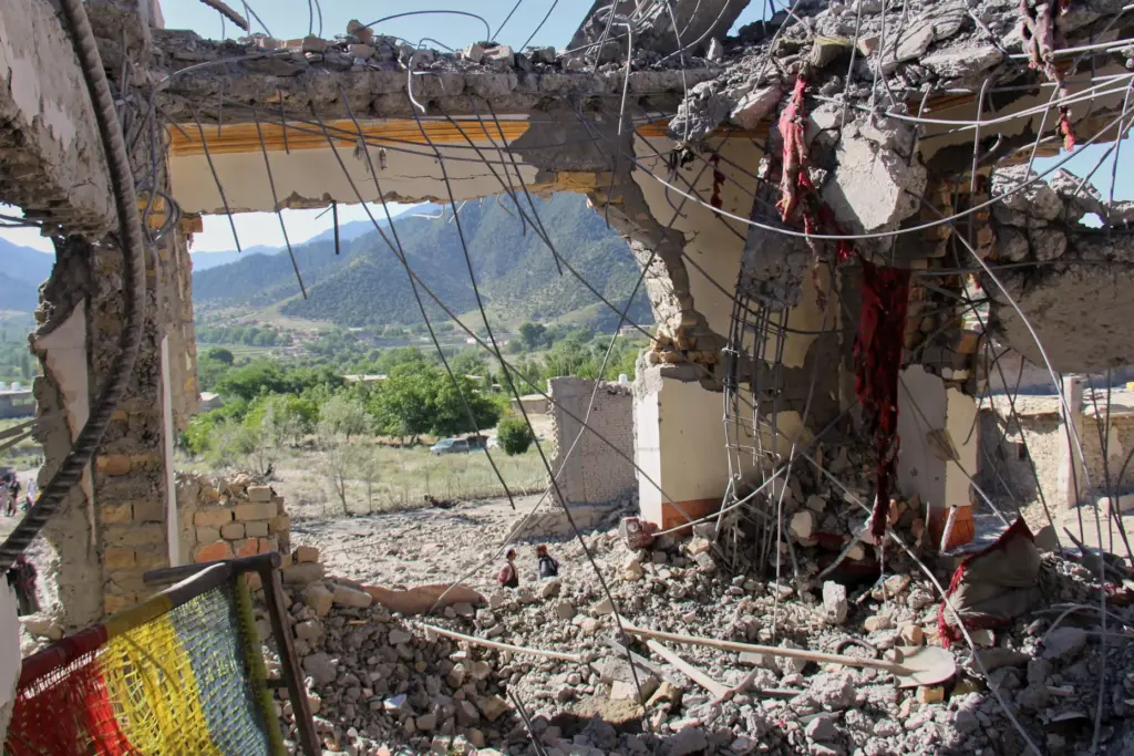 The remains of a destroyed house are seen in Mandokhail, Afghanistan.