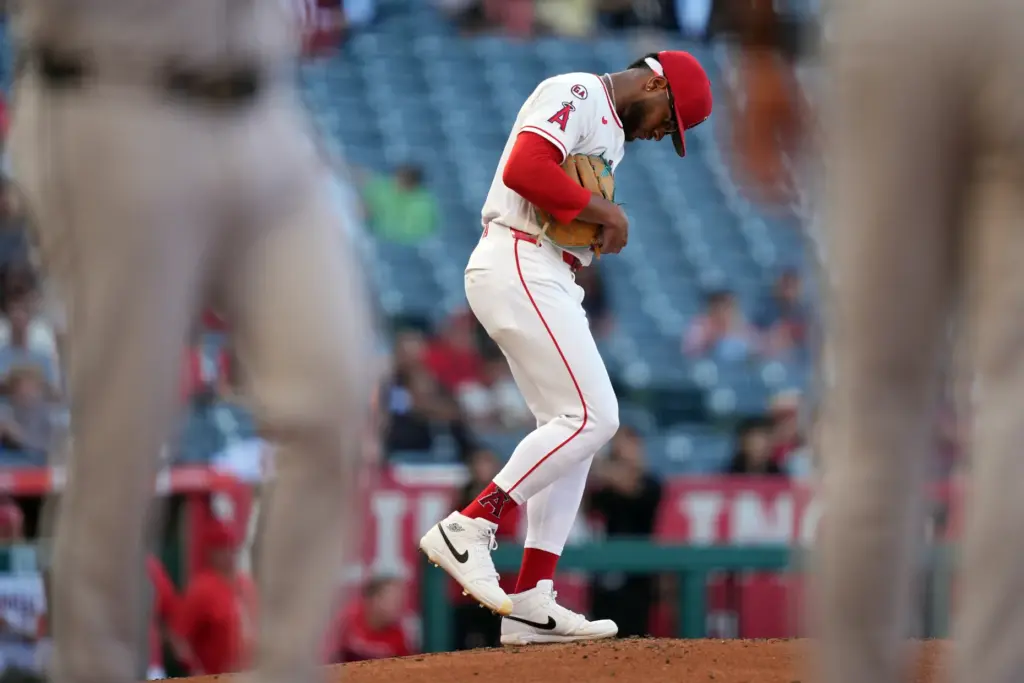 Angels starting pitcher Walbert Urena kicks the dirt on the...