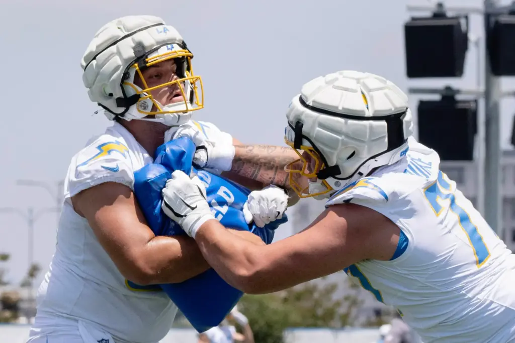 From left, Chargers center Jacob Spomer and tackle Travis Burke...