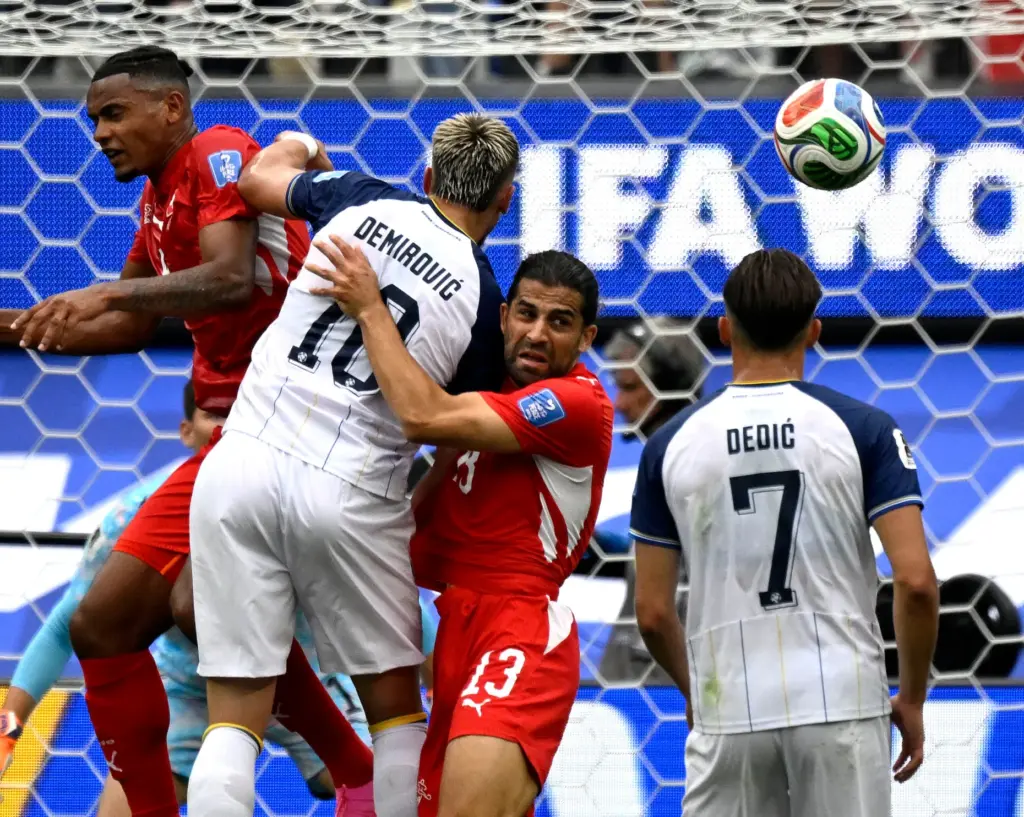 Switzerland defender Ricardo RodrÃ­guez(13)during tries to clear a ball out...