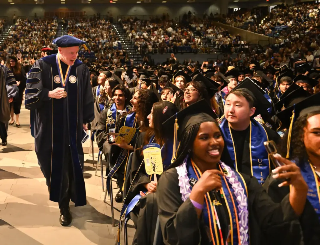 Chancellor Howard Gillman greets students during the commencement ceremony for...