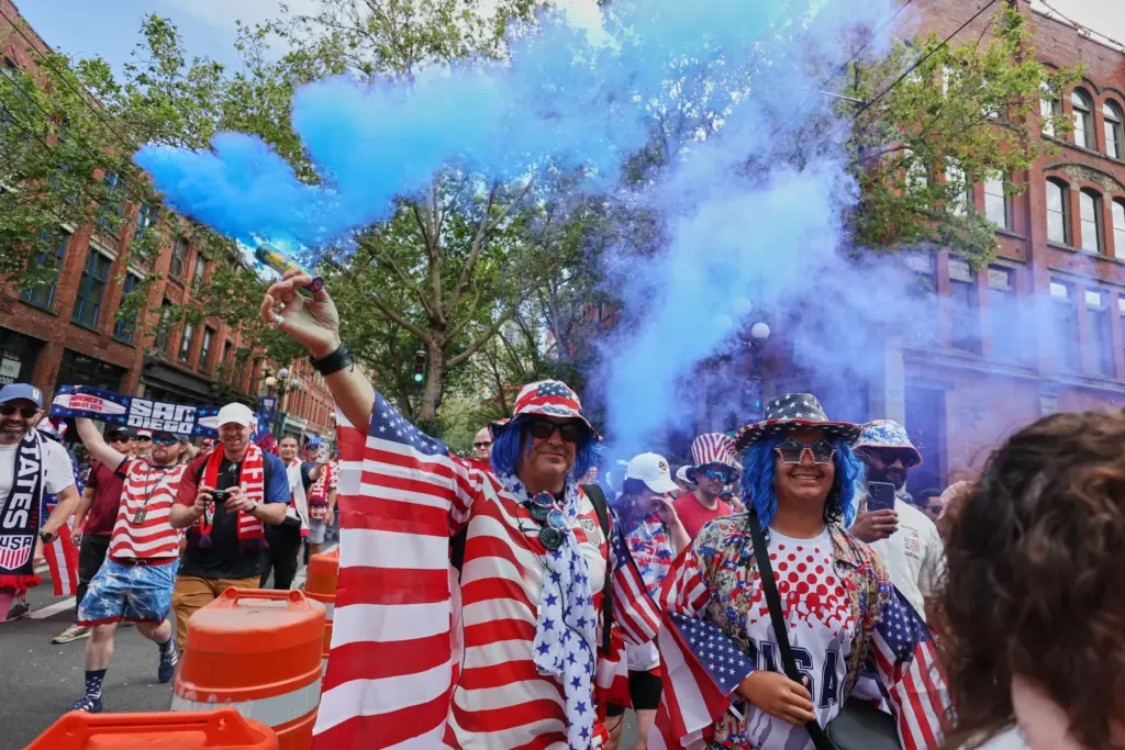 United States fans march to the match before the World...